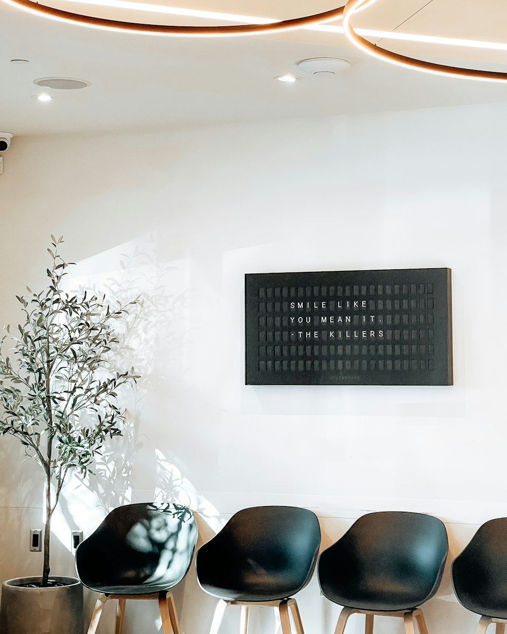 A calm, well-lit waiting room with a row of chairs